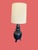 Rare Ebony Mid Century Lamp with Linen Barrel Shade, in the style of James Mont. Chalkware vessel shaped base has a matte...