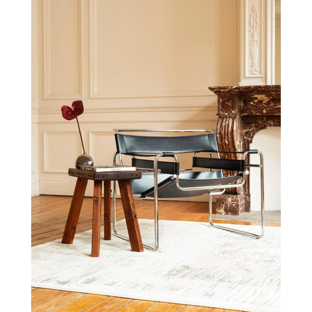 This authentic pre-industrial wooden bench originates from the early 19th century and was likely used as a small workbench...