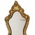 Small vintage mirror with a decorative crest in the classic Baroque style, crafted from wood and gesso gilded with gold...