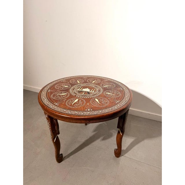 Add an exotic and timeless accent to your interior with this beautifully handcrafted antique Indian side table. Made from...