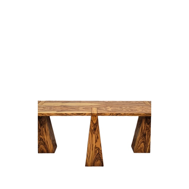 Splendid 3-legged console entirely made of wood covered in olive wood veneer. The legs fit perfectly into the top making...