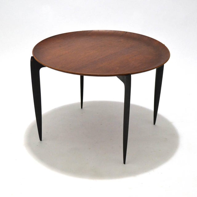 Light, leggy, and incredibly useful, this tray-top table designed by Svend Aage Willumsen & H. Engholm and made by Fritz...