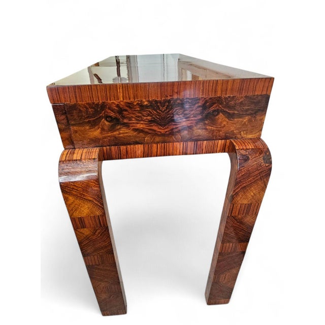 Art deco console table with walnut covering. Made in the 1930s. 3-drawer curved leg, clean design home decoration item....