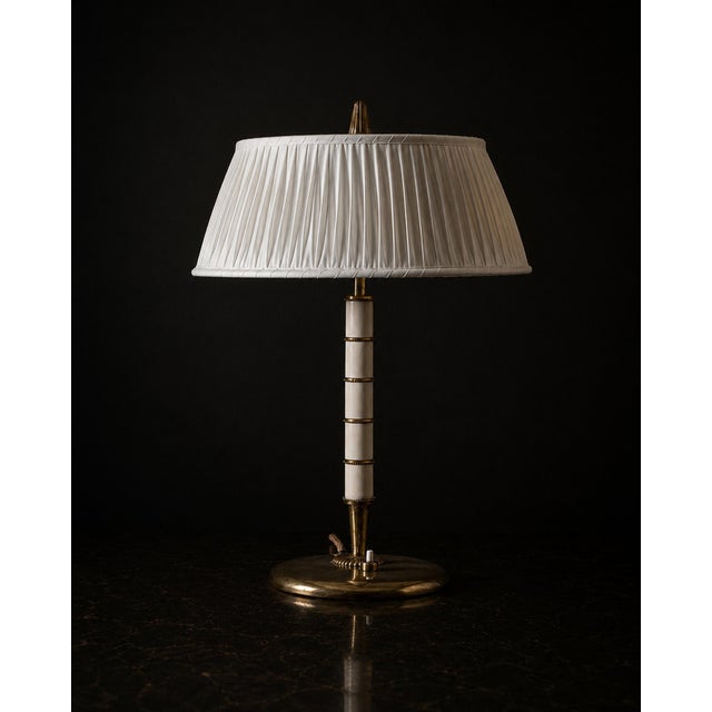 Table Lamp in Brass and Trolit by Bertil Brisborg for Nordiska Kompaniet, 1940, in Very Good conditions. Designed 1920 to...