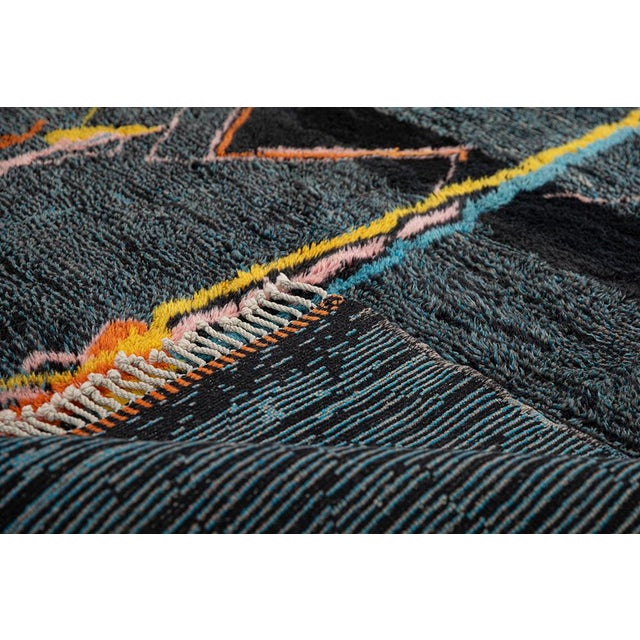 Dynamic hand-knotted wool rug showcasing a deep Charcoal Black and Ultimate Gray backdrop with intricate, abstract lines...