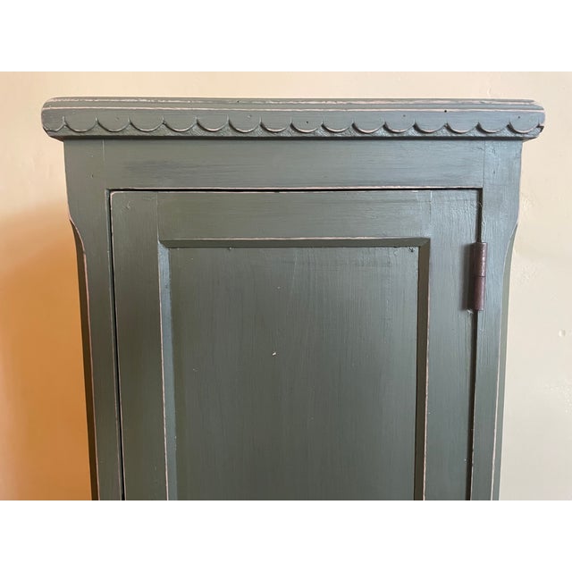A beautiful French wall cabinet. Not too large and shallow. It's very pretty and subtle, with a wavy edge to the frame....
