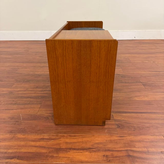 Vintage teak one-person bench with storage, made in the U.K. by Nathan Furniture circa 1970's. Designed for a corded...