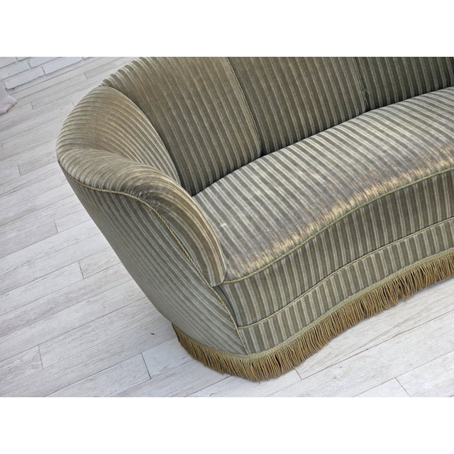 1970s, Danish 2-seater curved sofa. Original light green striped furniture velour. Springs in the seat, beech wood legs....