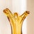 The heavy, teardrop base rises into a slender waist and opens into a dramatically pulled, three-pointed rim. Thick clear...