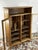 Wardrobe with display case and upper shelf, beech wood, mid-20th century. Its ample storage and display space, as well as...
