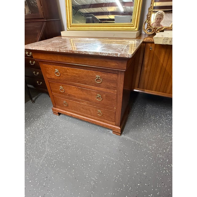 French Antique Marble Top Louis Phillipe bachelors chest with brass pulls. Made of solid cherry wood.