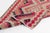 This is a vintage Turkish Oushak rug from the Mid 20th Century. The piece was hand-knotted.