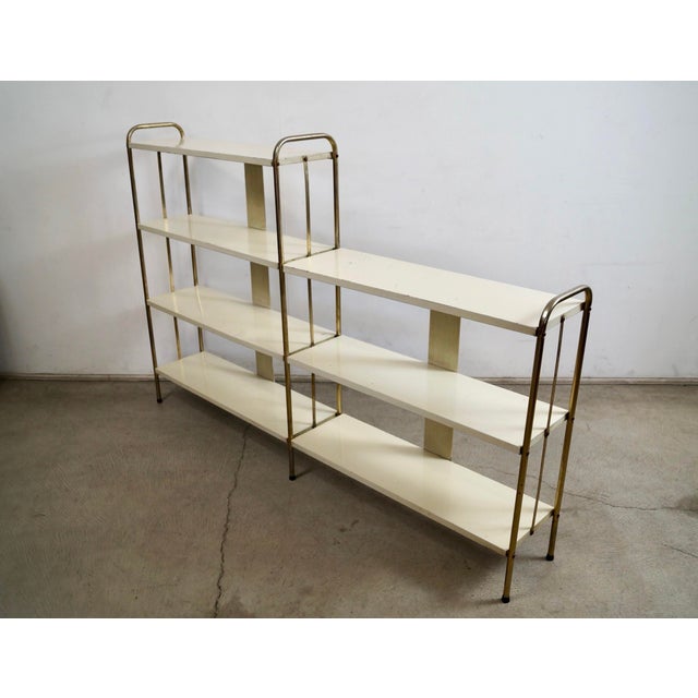 Vintage 1950's Mid century Modern double bookcase for sale. It's a very rare and unique shelf with a unique design, and is...