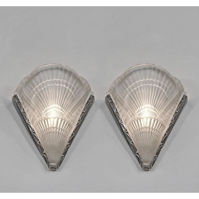 NOVERDY wall sconces A wonderful pair of large 1925-1930 French art deco wall lights. The solid brass mounts hold two...