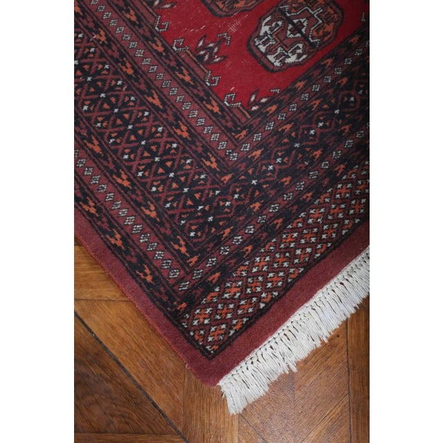Hand-knotted Pakistani Bukhara rug. Wool on cotton warp. Weaving density around 250,000 knots per m2. The rug is in good...