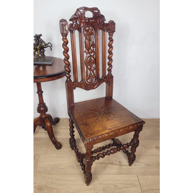 This is a gorgeous Jacobean styled Oak hall chair showcasing excellent carvings from the Victorian era. Circa 1890. The...