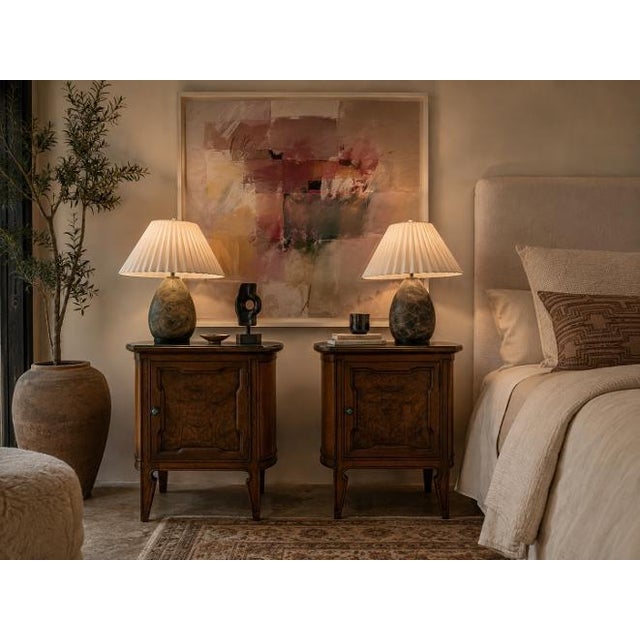 Elegant pair of vintage demilune end tables or nightstands designed by Harold Schwartz for Romweber. Crafted in warm-toned...