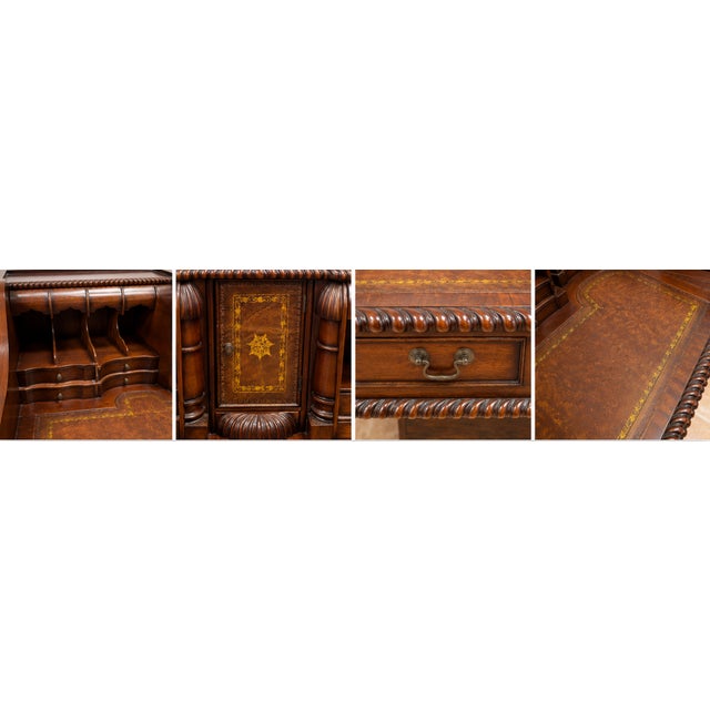 Beautiful vintage secretary desk featuring rich mahogany wood, intricate carved details, and a classic leather inset...