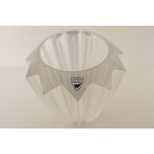 This Orrefors “Zodiac” vase is crafted from brilliant lead crystal and features the line’s signature sculpted, multi-...