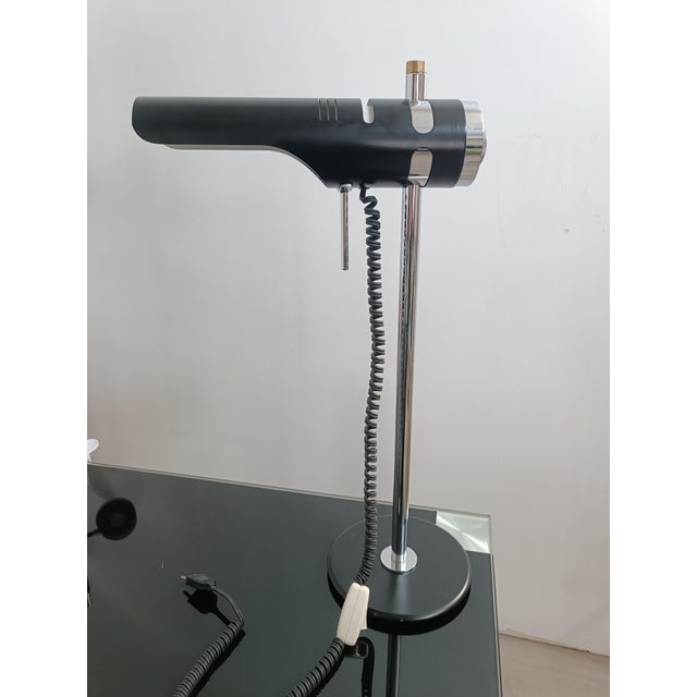 Magnificent and rare designer desk lamp, model 603 by M. Marca. Spain, 1970s. Black lacquered and chrome-plated metal. The...