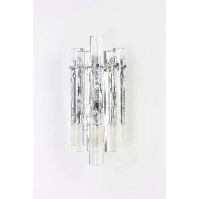 A stunning pair of chrome sconces with crystal glasses, made by kinkeldey, germany, circa 1970-1979. It’s composed of...