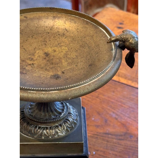 A neoclassical designed gaze. We love the perching birds.