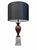 An elegant pair of Donghia table lamps showcasing a striking combination of tri-color marble construction. The contrasting...