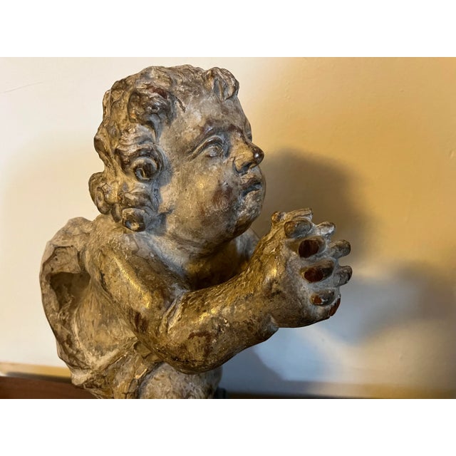 Antique early 19th century Continental carved wood cherub. Exceptional quality with detailed carving from a single piece...