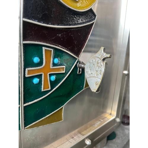 This vintage built-in Belgian tabernacle features a striking enameled decoration in vivid tones of green, yellow, orange,...