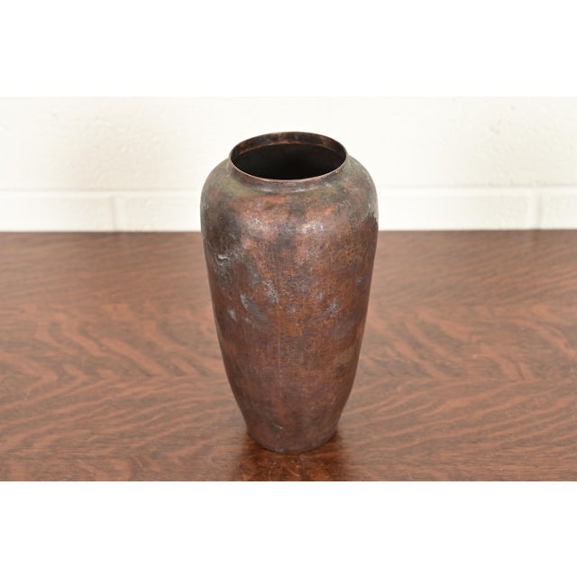 A gorgeous Arts & Crafts hand hammered copper vase In the manner of Roycroft By Ramon Ramirez Mexico, Mid-20th Century...