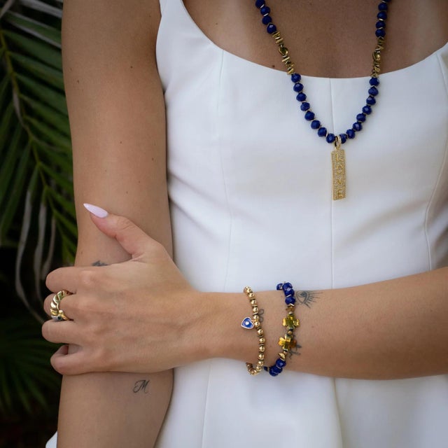 Embrace the energy of love, loyalty, and inner peace with the Deep Love Blue Crystal & Heart Charm Gold Bracelet Set. This...