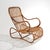 A rattan armchair from the 1950s characterised by a sinuous and highly sculptural structure, constructed through a...