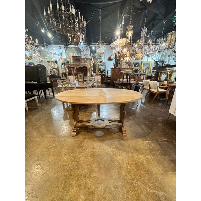 The 19th c. Italian Bleached Walnut Drop Leaf Table is a stylish and functional piece of furniture. This rectangular table...