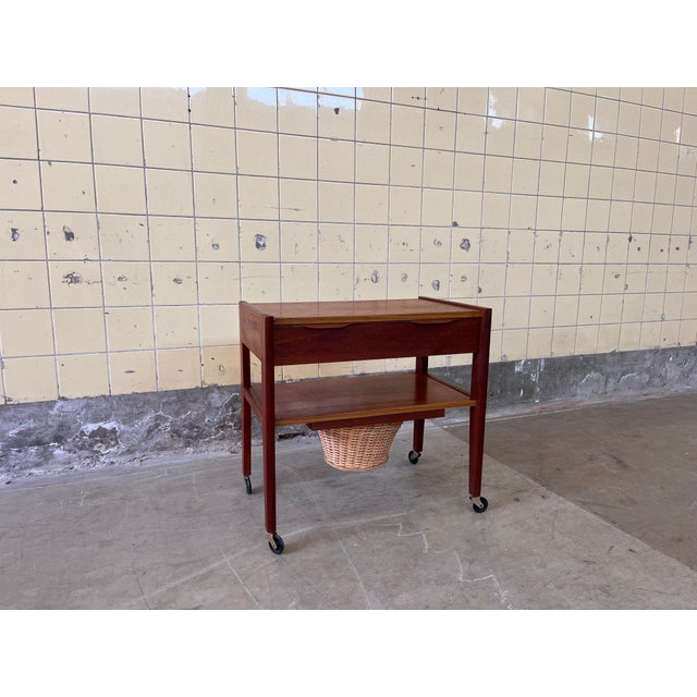 This beautiful vintage Scandinavian side table in teak combines elegant design with practical functionality. The table...
