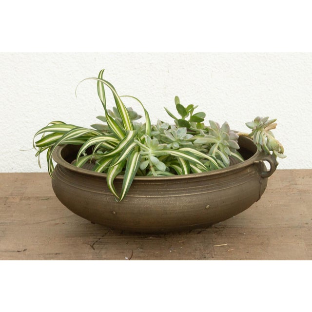 This 19-inch Urli is a remarkable found artifact, hand-cast by master metalsmiths in Kerala using the heritage lost-wax...