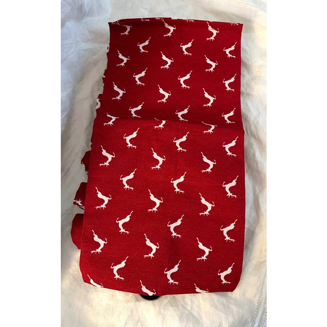 New White Reindeer with Red background Napkins with silver napkin rings a set of 8. never used. Used for staging only....