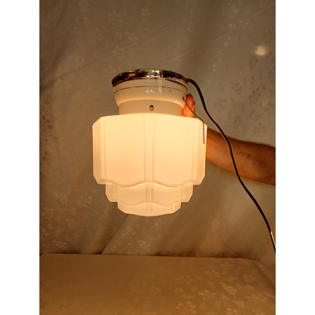This striking antique Art Deco tiered ceiling light fixture features a beautifully layered, scalloped design reminiscent...