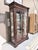 A richly appointed Henredon display cabinet crafted in a deep mahogany finish with refined Georgian influence throughout....