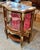 Elegant and richly detailed, this French Louis XV-style display cabinet is crafted from solid wood and designed to...