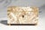 Delicate, luminous, and exceptionally charming, this exquisite 19th-century English mother-of-pearl miniature box is a...