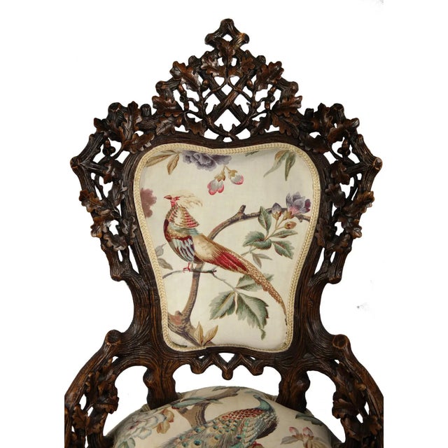Black Forest carved oak chair. Made in the 1880s.