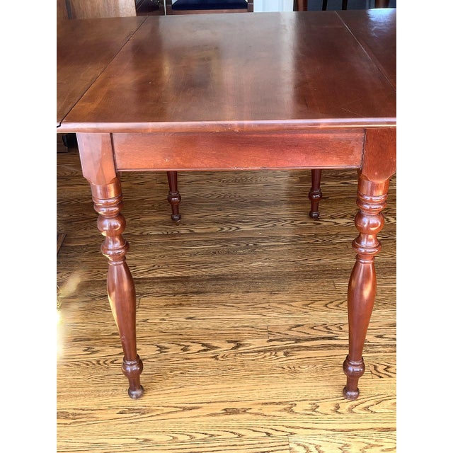 This classic drop leaf, cherry dining table is in beautiful condition, having been lovingly cared for by its original...