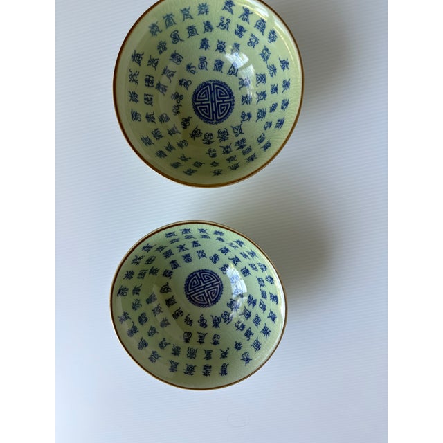 Beautiful celadon bowls with Chinese characters. Signed on bottom. 2 bowl set.