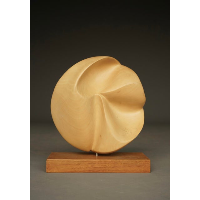 A nice and very decorative hand crafted abstract sculpture in beautiful applewood. The carving giving the sculpture...