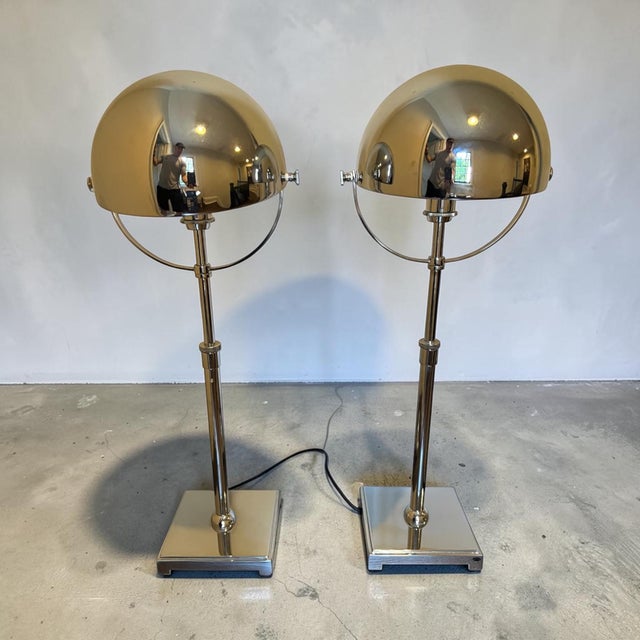 HEMISPHERE TABLE LAMP. A desk table lamp with a hemisphere-shaped shade in polished chrome finish. The polished chrome...