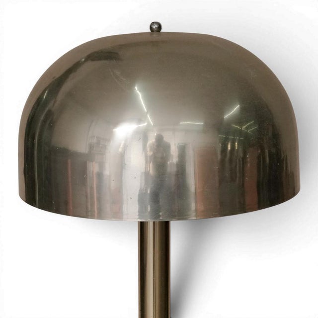 A 1960's modern floor lamp by Laurel Lamp Company. The domed aluminum shade has a chrome plated iron support and a...