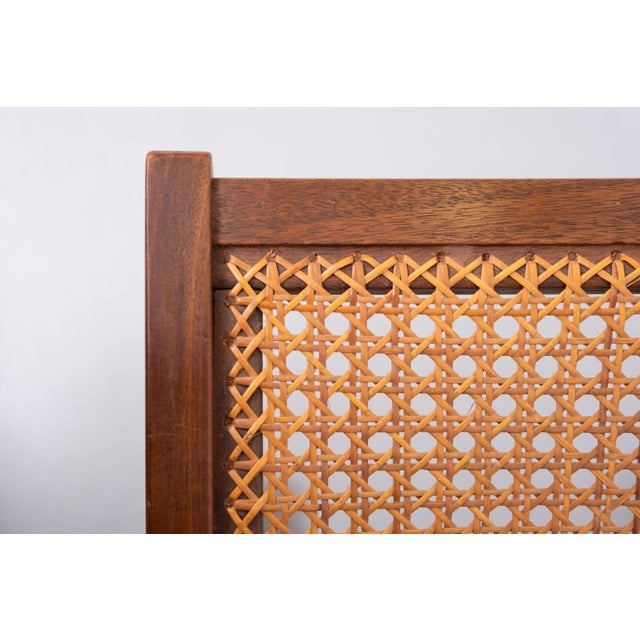 Very nice organic shaped footstool .Solid Oak wood ,comes with a Wicker upholstery . Good condition . 1960s Holland .