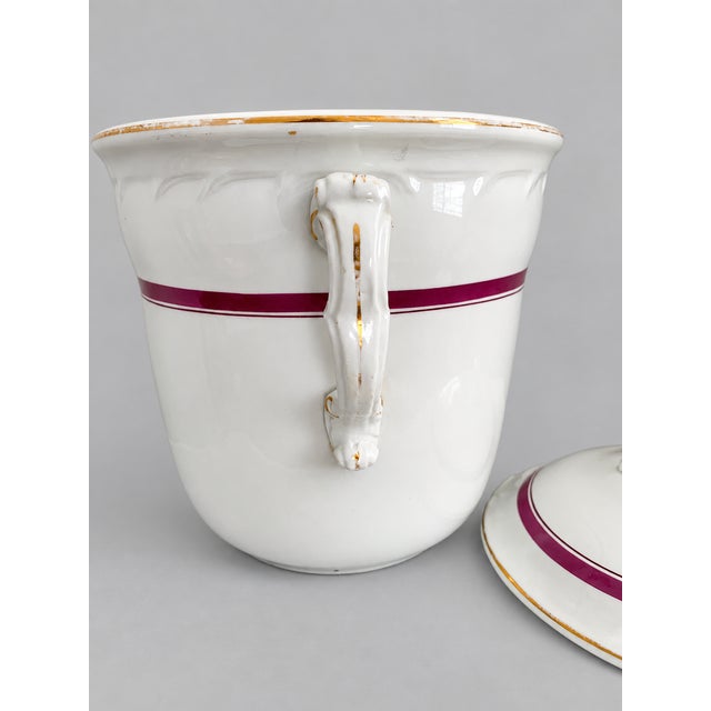 A striking and unusually refined American white ironstone covered slop jar, dating to the Mid-Victorian period, circa...