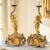 A finely executed pair of late 19th-century French gilt bronze figural candlesticks, conceived within the Rococo Revival...