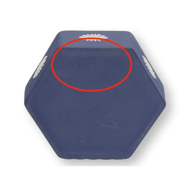 Early twentieth century Wedgwood Jasperware trinket box in classic cobalt blue with cream neoclassical relief decoration....
